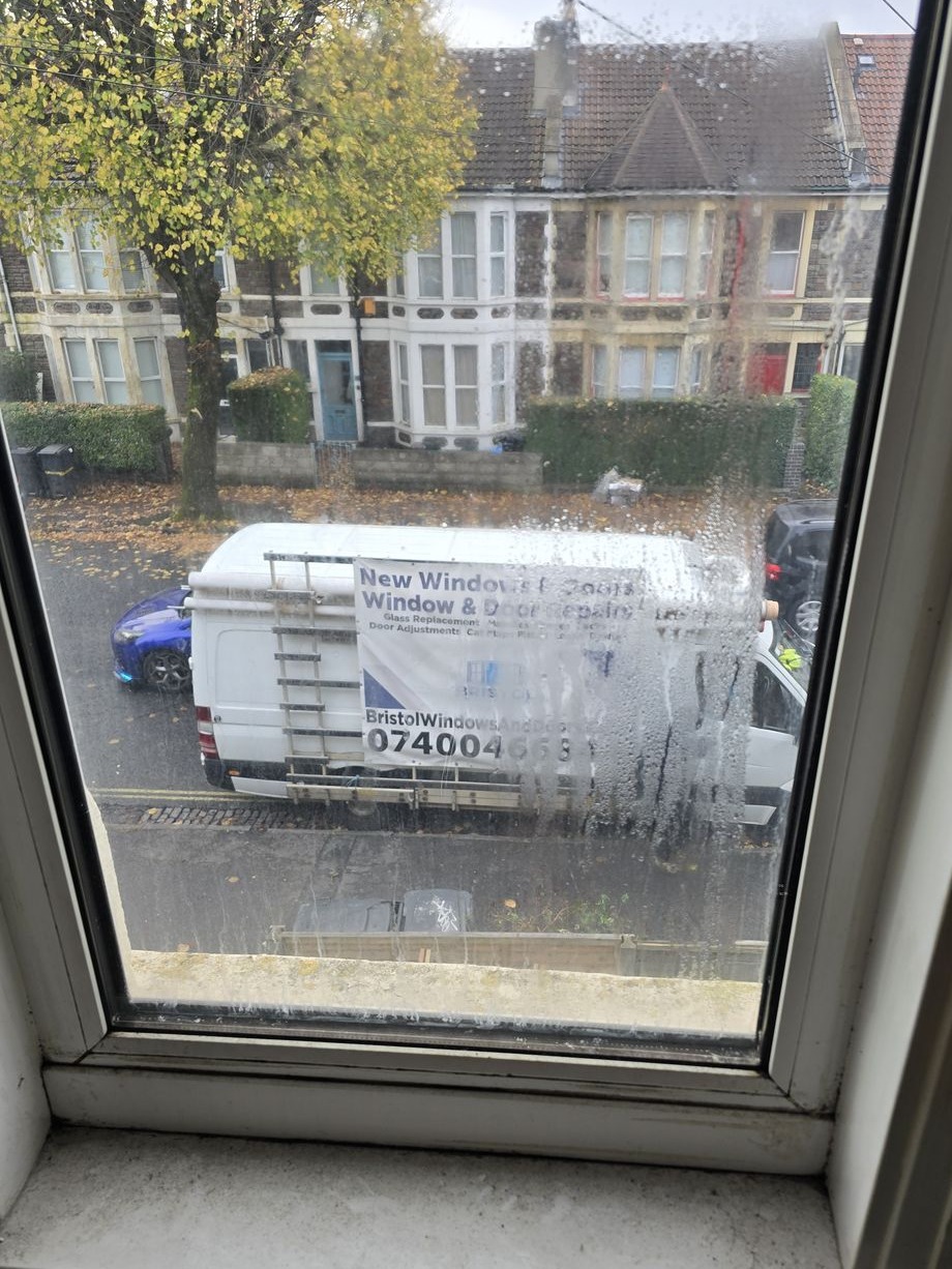 Misted double-glazed window before replacement — condensation visible between panes