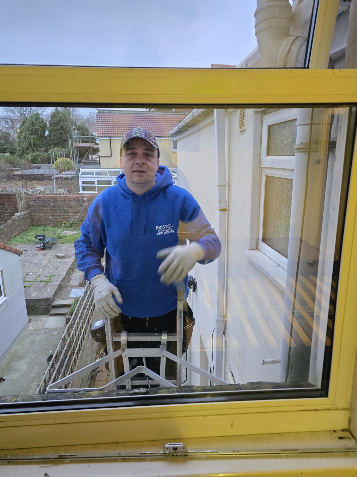 Matthew from Bristol Windows & Doors fitting a window on site